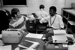 Ohio University Post editor Andy Alexander works while Clarence Page (with toy gun) and Mark Roth clown around 09-26-1968