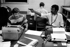 Ohio University Post editor Andy Alexander works while Clarence Page (with toy gun) and Mark Roth clown around 09-26-1968