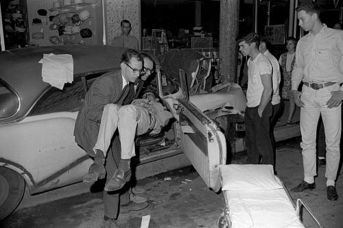 John Carpenter - Walter Joe Ford remove victim from wreck in front of Montgomery Wards 04-23-1966