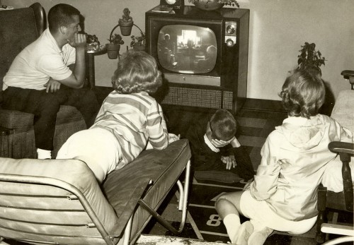 Albert Underwood, Bill Hopkins, Linda Folsom watch TV in Steinhoff basement