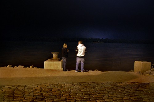 Couple watching Mississippi River flow by Cape Girardeau
