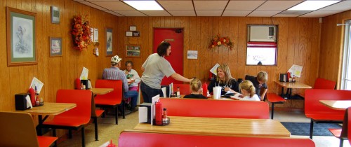 Sarah serving Wib's customers