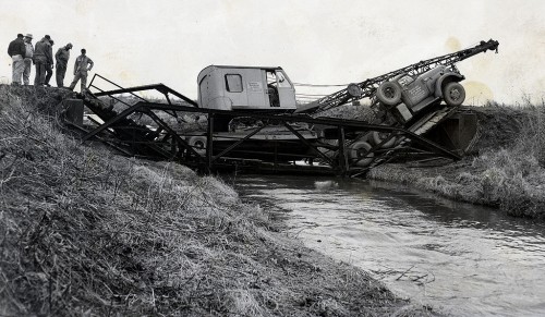 Steinhoff, Kirkwood & Joiner dragline and lowboy on broken bridge