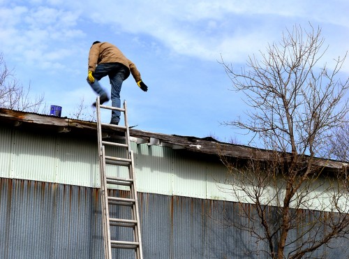 Mark Steinhoff repairing roof at Dutchtown 02-09-2013