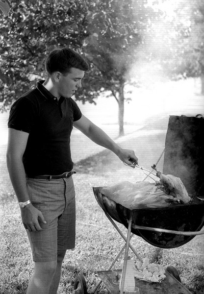 Tom Holt grilling chicken c 1965
