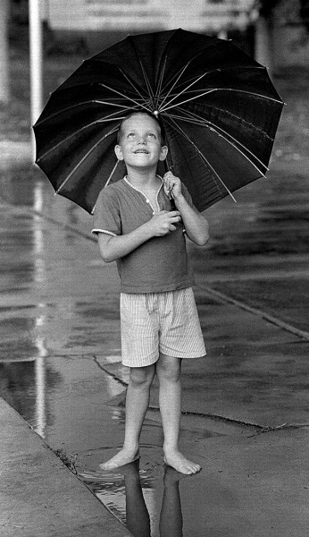 Boy with umbrella c 1966