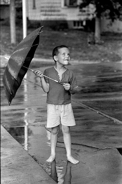 Boy with umbrella c 1966