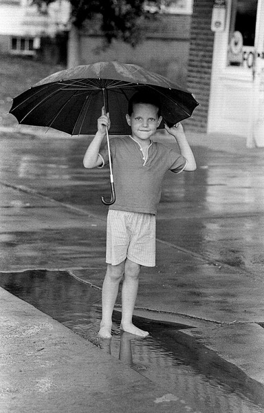 Boy with umbrella c 1966